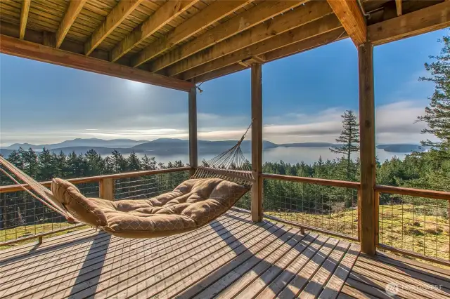 This will be your go to zen place. You will feel like you are floating while watching nature shine. This deck is off the south bonus room on the main level.