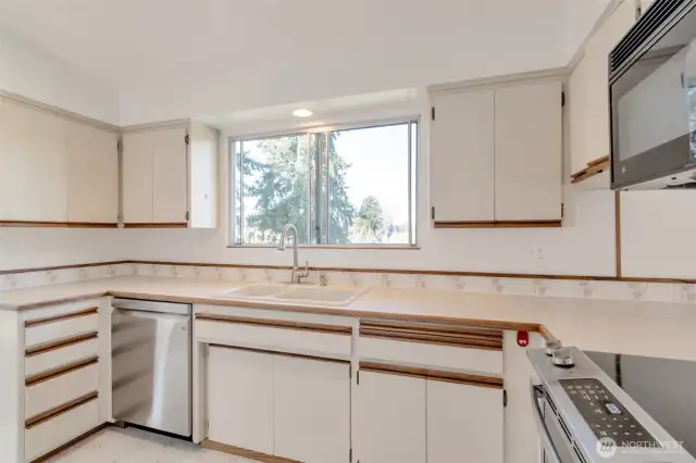 Bright Kitchen with window view looking at sunsets