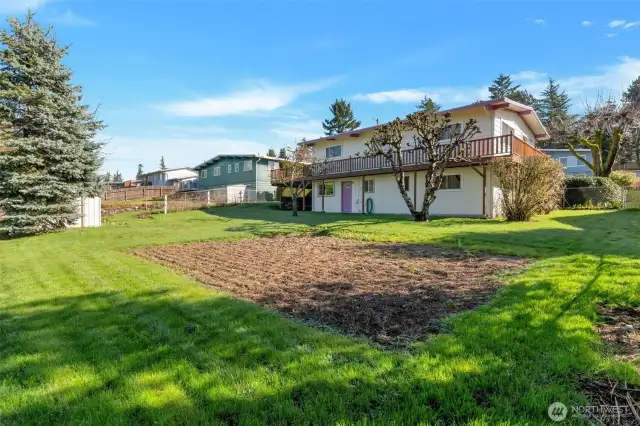 Garden area ready to go! Fully fenced backyard, great for kids and pets!