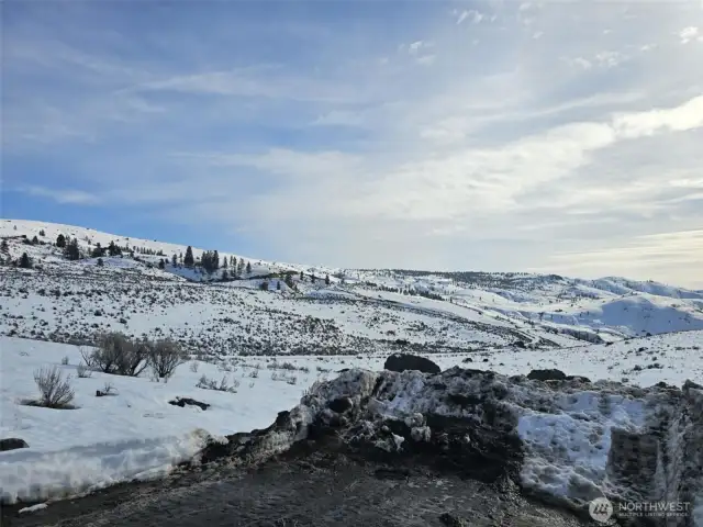 Looking SE in the winter from well site building pad.