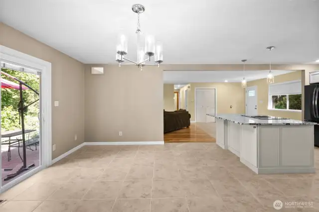 Dining room opens to the kitchen with sliding glass door to the backyard