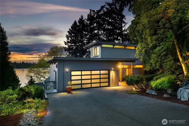 Mid-Century Modern living with Lake Washington views, nestled in a tranquil setting above the shores of Lake Washington. This exquisitely reimagined mid-century modern residence offers a harmonious blend of timeless architecture and sophisticated modern updates. Thoughtfully restored, creates a rare fusion of iconic design, elevated Comfort, and seamless indoor-outdoor living.