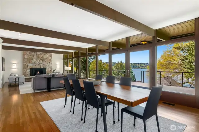 Step into sun-drenched interiors where walls of window blur the boundaries between inside and out. The expansive living and dining areas open effortlessly through French doors extending your living space onto an Expansive deck, inviting you to relax, entertain, while enjoying lake views, and calming the natural surroundings including humming stopping by for a visit.