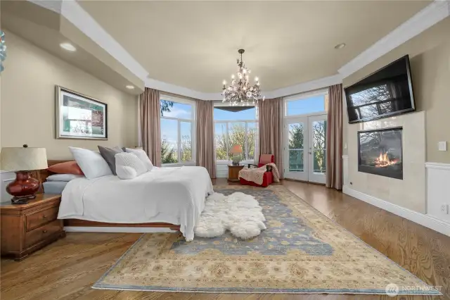 Luxurious master suite with seasonal views of city skylines and the lake