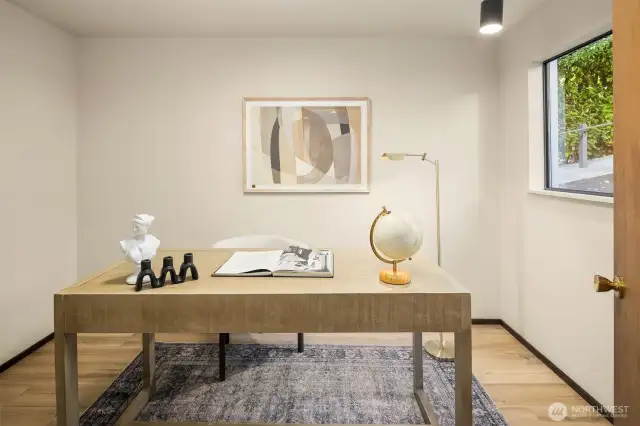 Versatile area currently staged as a den, it also could be used as a large pantry or small bedroom.