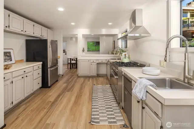 The kitchen flows into the eating area which opens onto the back deck.