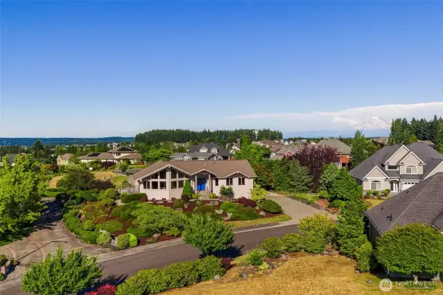 Welcome to McAllister Park—where scenic vistas and luxury living meet. This beautiful home sits proudly on a hilltop lot with commanding views of Mt. Rainier, the Black Hills, and the Olympic Mountains. Surrounded by vibrant landscaping and timeless architecture, it's the kind of neighborhood you’ll never want to leave.
