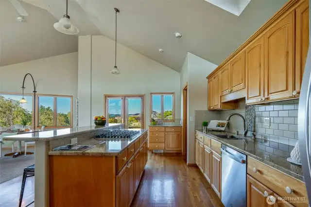 Whether you're whipping up weeknight meals or hosting holiday feasts, this kitchen delivers with expansive granite counters, stainless steel appliances, and ample cabinetry to keep everything organized and within reach.