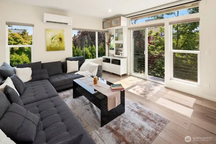 Main floor living room with projector and speakers