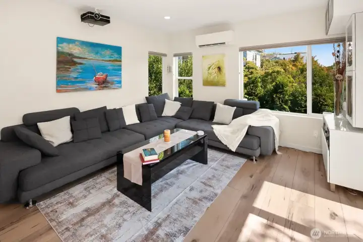 Main floor living room with projector and speakers