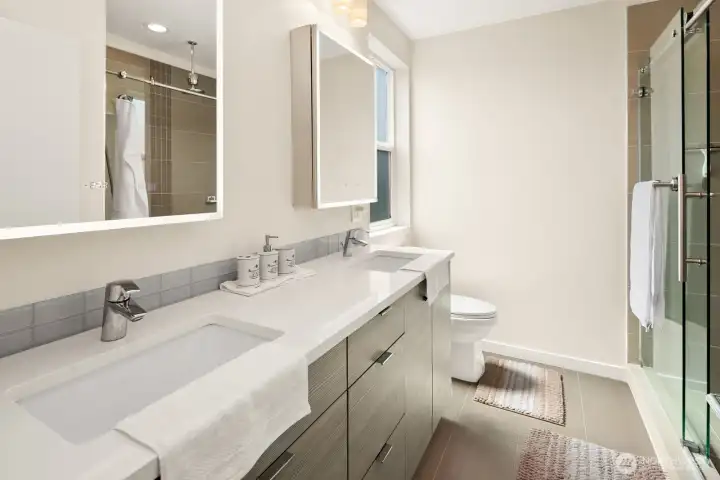 Primary bathroom with ring lighted mirrors