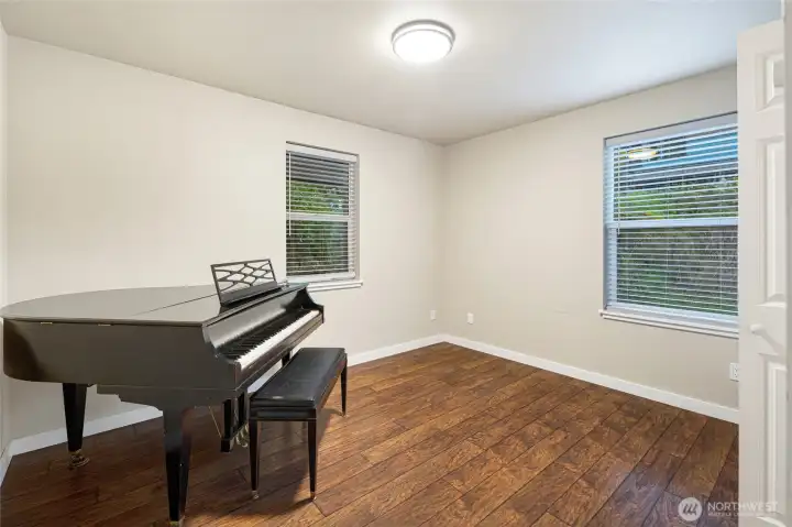 first bedroom on the left. Piano has been removed