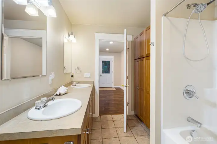 full bath with dual vanity