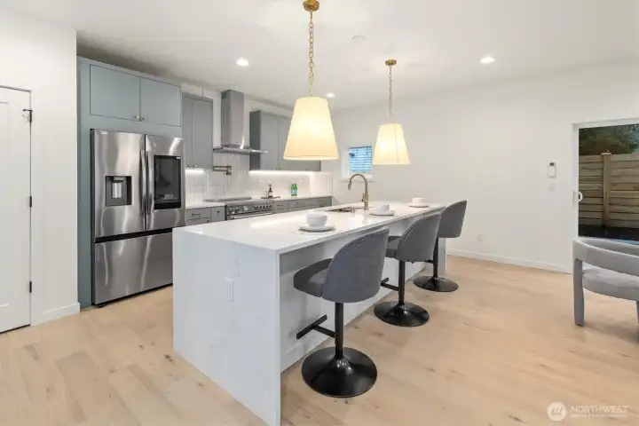 Kitchen has plenty of cabinets, storage and prep space