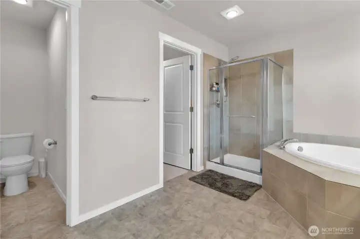 Primary ensuite bath view one, I love the separate water closet, the walk-in closet, and the true 5-piece primary bath with separate shower and soaking tub, ahhhhhh.