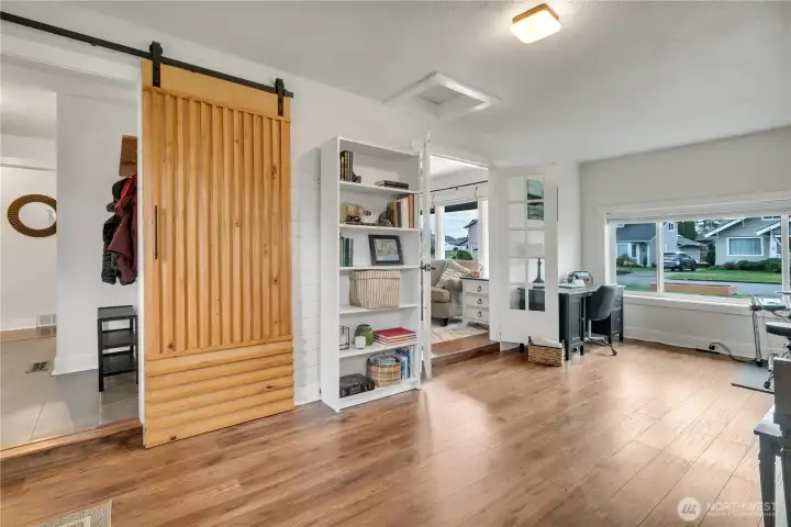 Another view of the family room wih sliding wood door to large laundry room.