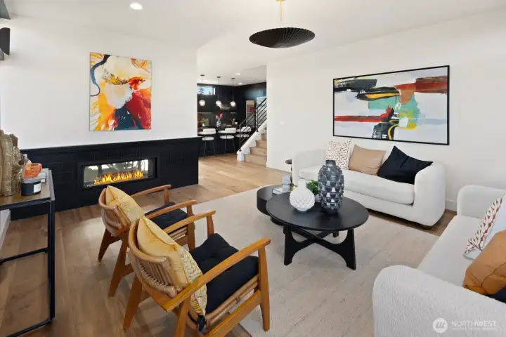 Living room has see-through fireplace separating living room from dining area.