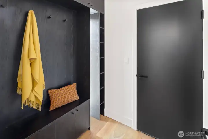 Mud room at entrance to home from the garage
