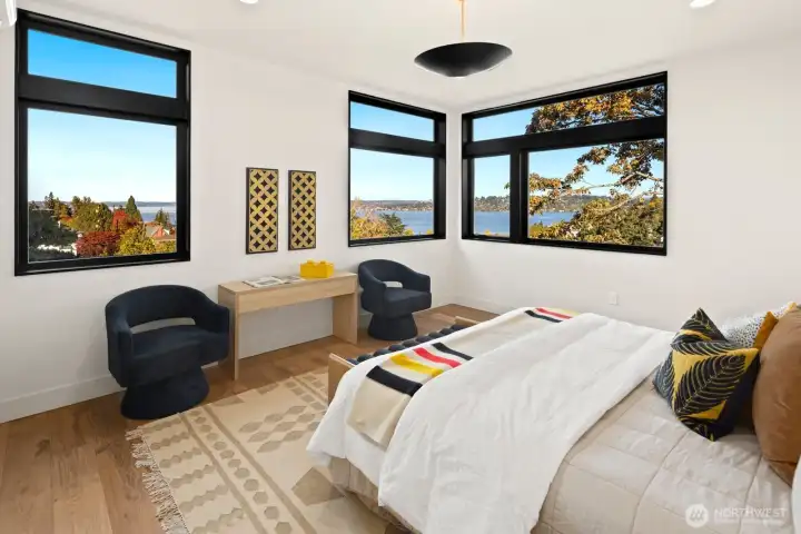 Primary bedroom takes full advantage of the lofty view.