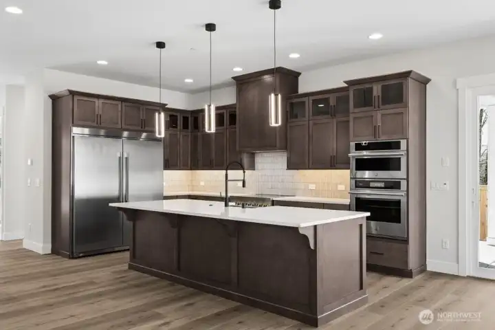 Huntwood soft close cabinets with pull out lower shelves.