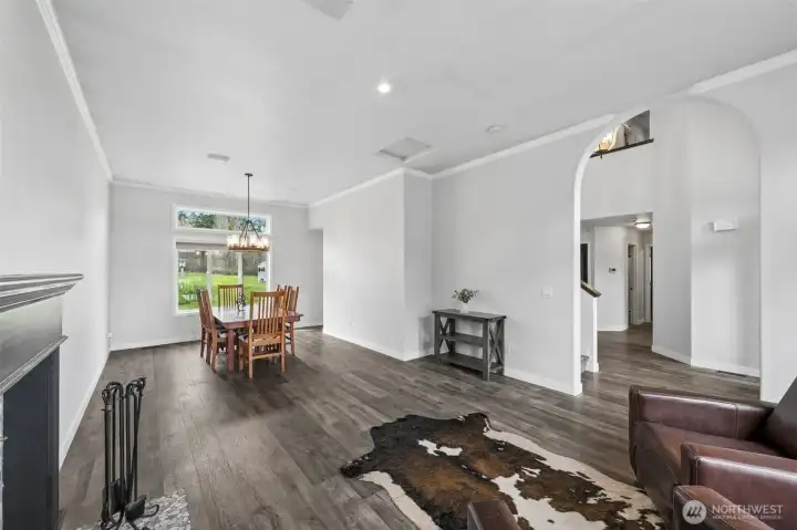 Through the arched entry from the foyer the formal living and dining rooms offer additional space for entertaining.