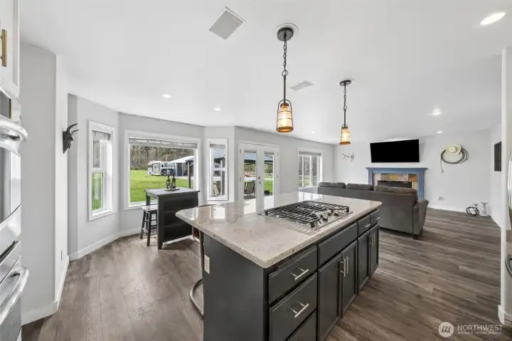 The open-concept family room and kitchen create a bright, airy space filled with abundant natural light—perfect for both everyday living and entertaining.