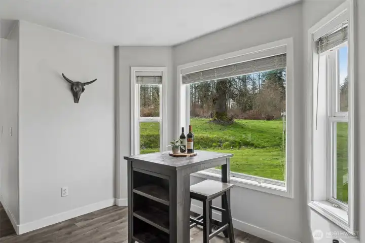 Kitchen nook overlooks a private oasis- quiet and peaceful backyard.