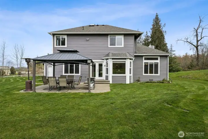 Rear view of the house with flat level ground to play.