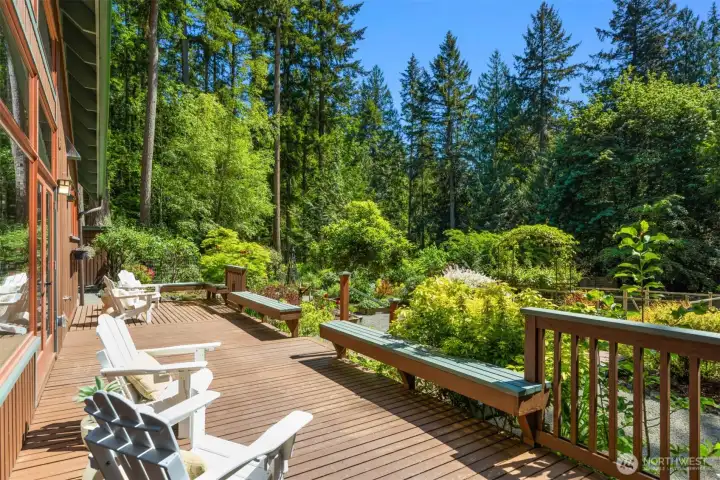 HUGE deck wraps the entire southern, garden, side of the main house!