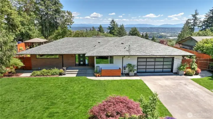 Set at the end of a quiet dead-end street on 1.5 acres, this reimagined mid-century modern rambler with basement offers sweeping views of The Cascades and Mount Rainier.