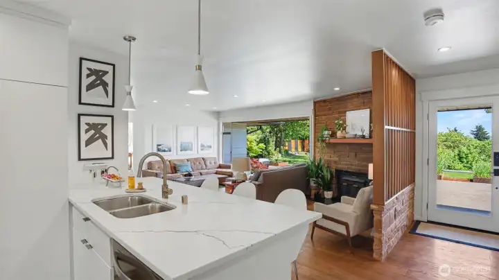 Open sightlines from kitchen and outdoor views.