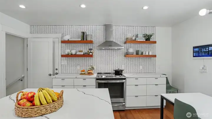 Trendy exposed shelves and high-end appliances.