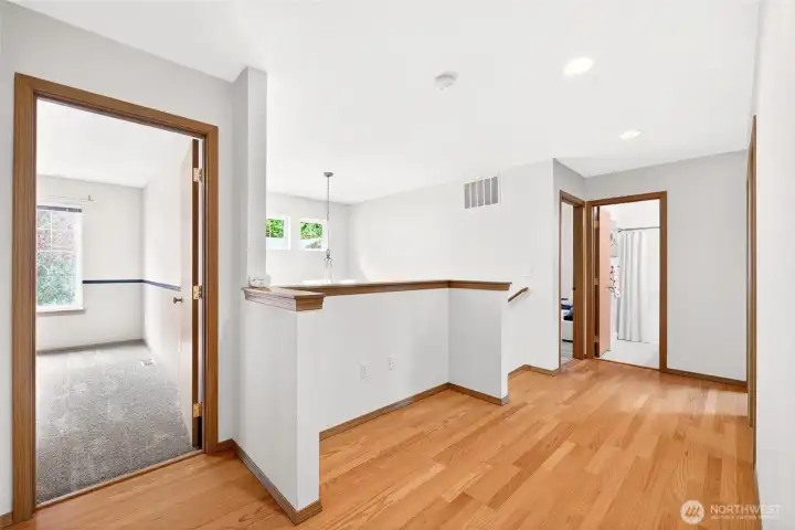 Landing from laundry room door. One of the 4 bedrooms to the left. Primary is left past the stairs. Full bath straight ahead. Landing from laundry room door. One of the 4 bedrooms to the left. Primary is left past the stairs. Full bath straight ahead.