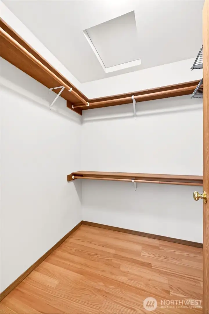 Walk in closet primary bedroom. Walk in closet primary bedroom.