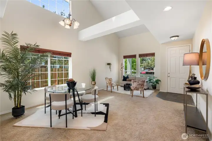 The seamless connection between the living and dining spaces creates a warm and welcoming atmosphere.