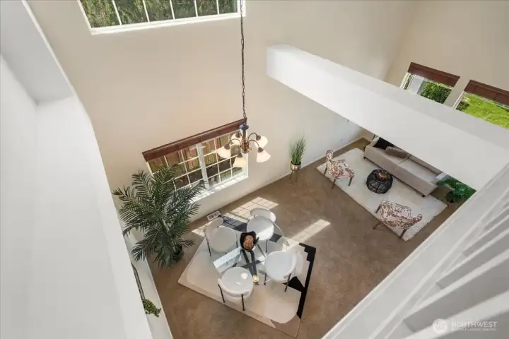 View from the upstairs looking down to the living and dining room.