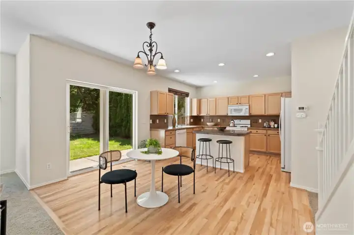 Adjacent to the kitchen the casual dining area offers a comfortable space for everyday meals.  Surrounded by natural light it seamlessly connects the kitchen, family room and backyard
