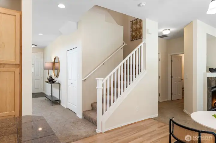 The formal living and dining rooms flow seamlessly into the casual dining area and family creating an open and connected layout .