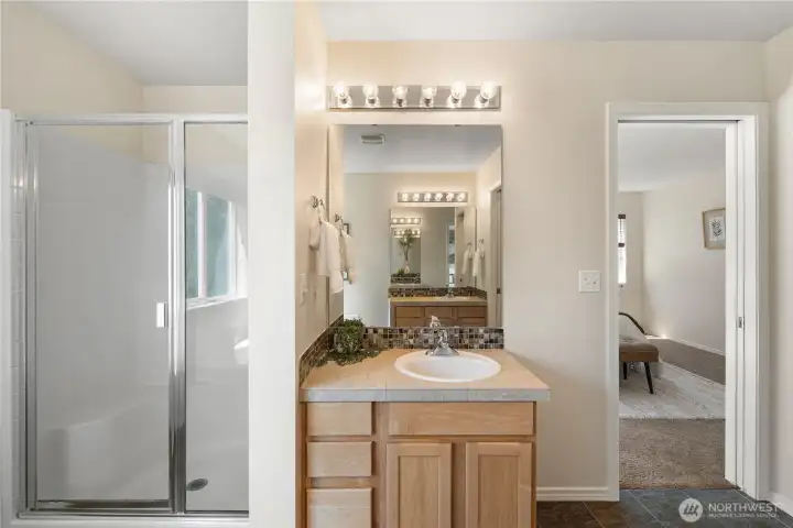 The en-suite bathroom includes a walk-in shower and  private separate water closet for the commode.