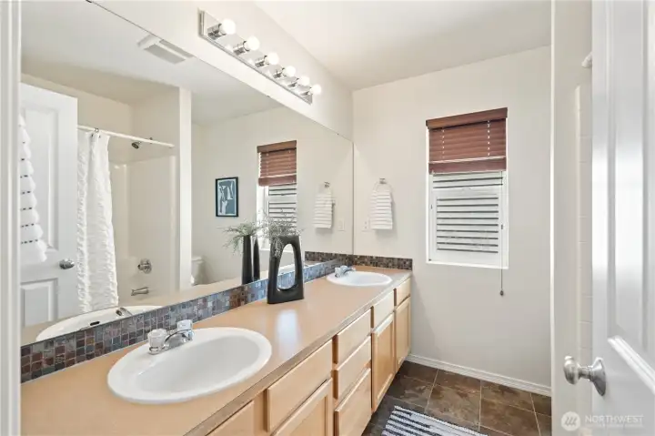 Additionally a Full bath upstairs, includes dual sinks, shower and tub combination.