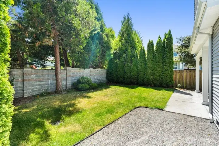Private backyard with a patio and an area to have a garden or enjoy sitting around a  firepit!