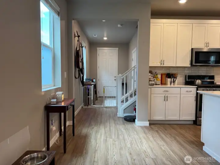 The entry way is joined by a door to the garage and the stairwell. The entry way is joined by a door to the garage and the stairwell.