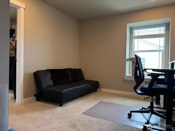 Here you see bedroom two being utilized as an office. It also has a walk-in closet. Here you see bedroom two being utilized as an office. It also has a walk-in closet.