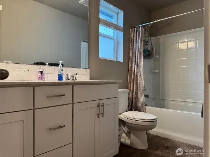 This full bath serves the three bedrooms upstairs. This full bath serves the three bedrooms upstairs.
