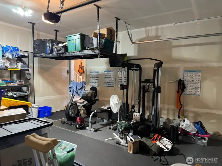 The garage has ample space for traditional shelves and suspended storage. The garage has ample space for traditional shelves and suspended storage.