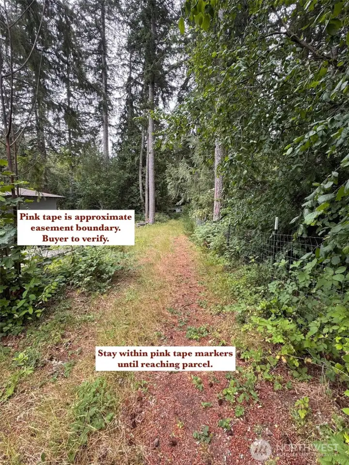 Looking down the easement after parking. Facing south. Looking down the easement after parking. Facing south.