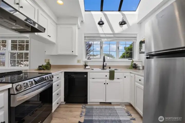The kitchen has vaulted ceilings and skylights. The kitchen has vaulted ceilings and skylights.