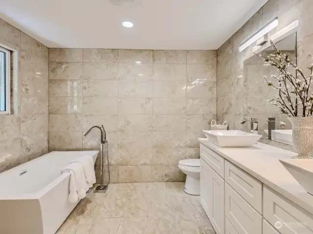 Luxe all new Primary Bath with floor to ceiling tile.