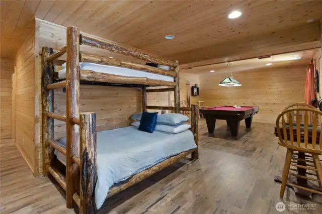 The rec room in the daylight basement has enough extra space for extra sleeping space. New Luxury Vinyl Plank floors down here!