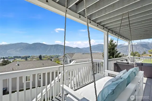 Hanging swing makes for a nice place to curl up with a good book or just enjoy the space.